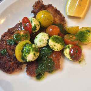 chicken milanese with tomato mozzarella and basil salad