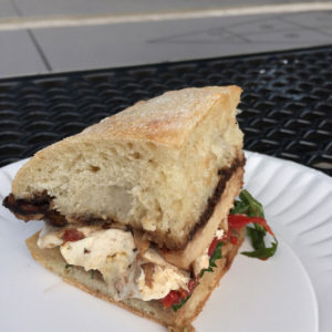 focaccia with grilled chicken mozzarella arugula and roasted peppers