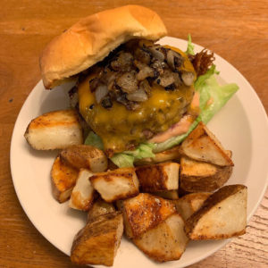 griddled onion cheeseburgers with special sauce and garlic potato wedges