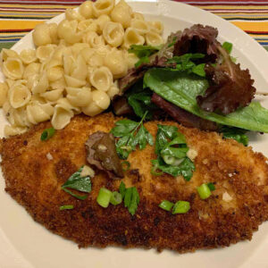 crisp chicken schnitzel with lemony herb salad