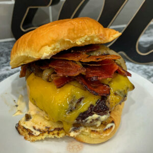cheddar burgers with a bacon onion saute